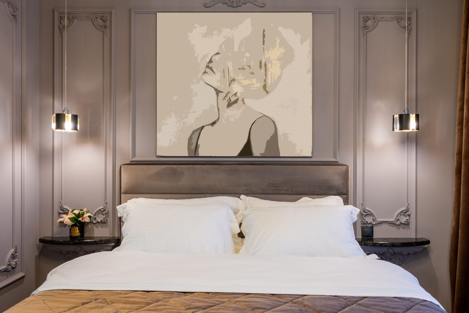 Modern bedroom interior with soft bed under painting of woman