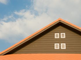 Orange and gray painted roof under cloudy