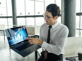 A man discussing using a laptop