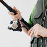 Person holding a fishing rod