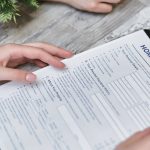 Person holding home insurance form