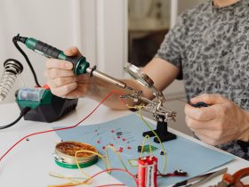 A person using a soldering iron