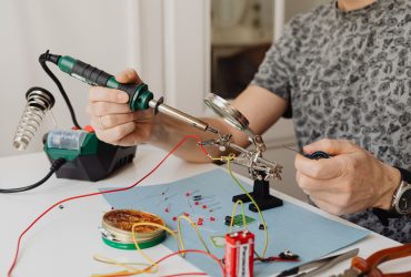 A person using a soldering iron