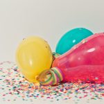 Yellow pink and blue party balloons