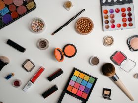 An assortment of beauty products on a white surface