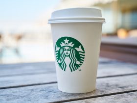 Closed white and green starbucks disposable cup